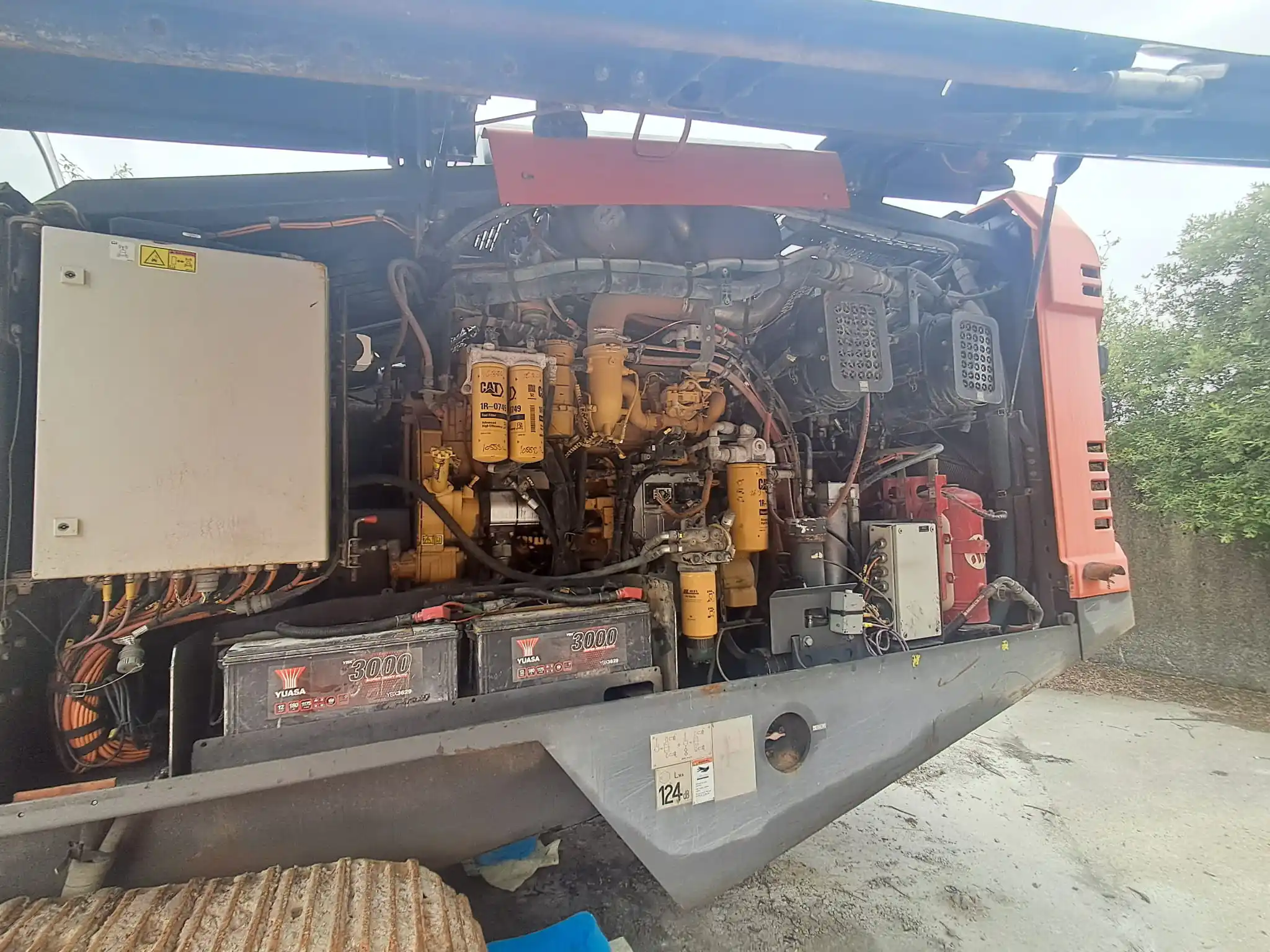 Red Sandvik D550 Leopard drill rig on crawler tracks, viewed from close range. | Sandvik